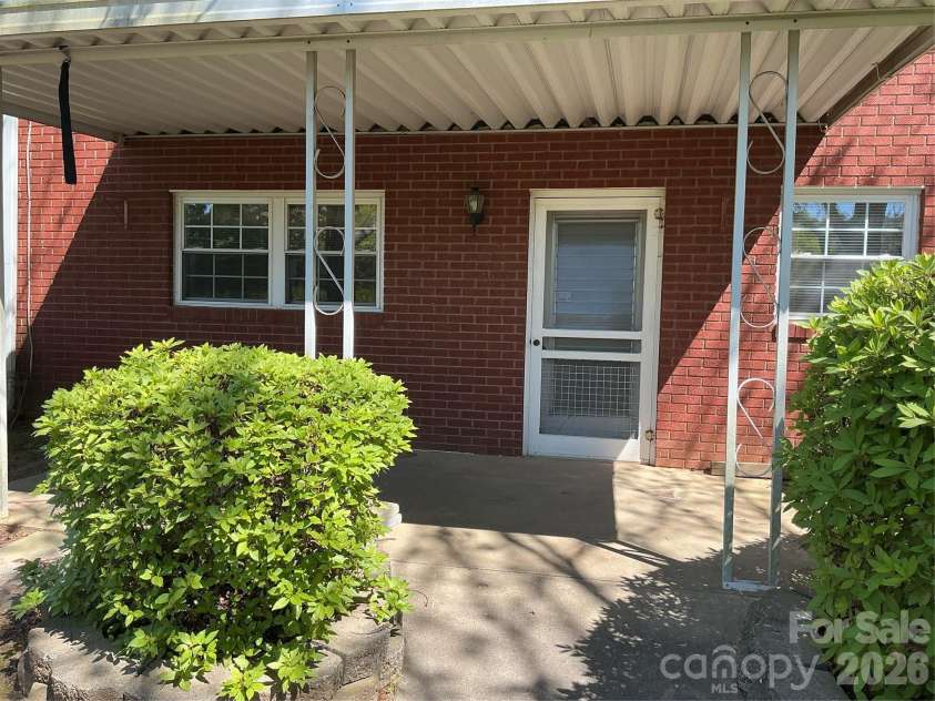 219 Central Avenue, Locust, NC 28097.  MLS# CAR4368249, YatesRealty ID 10940. Back patio