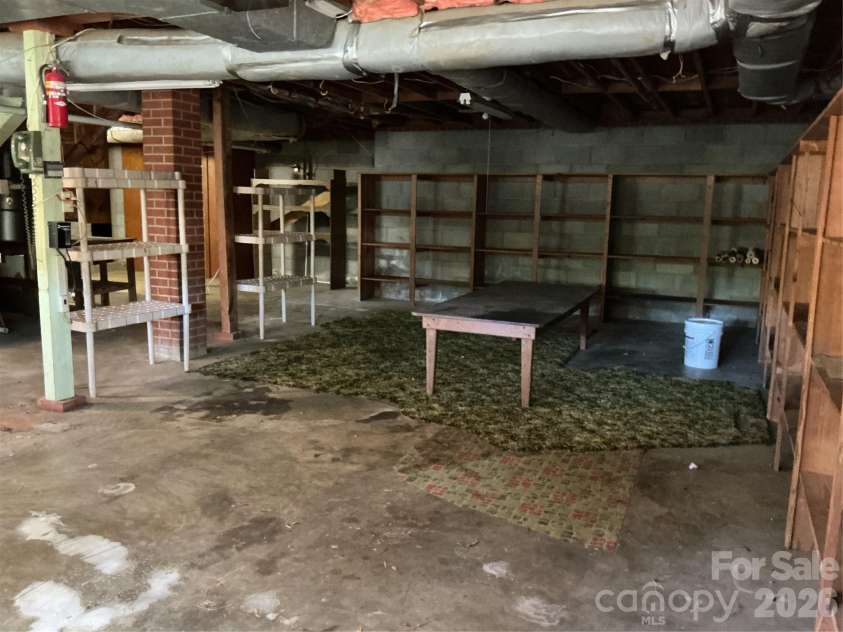 219 Central Avenue, Locust, NC 28097.  MLS# CAR4368249, YatesRealty ID 10940. Basement garage