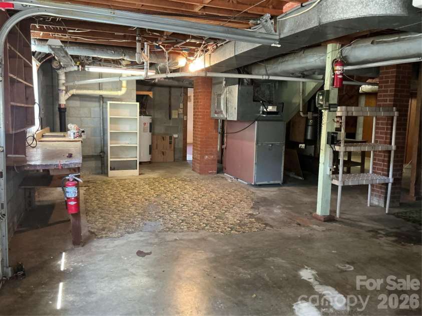 219 Central Avenue, Locust, NC 28097.  MLS# CAR4368249, YatesRealty ID 10940. Basement garage