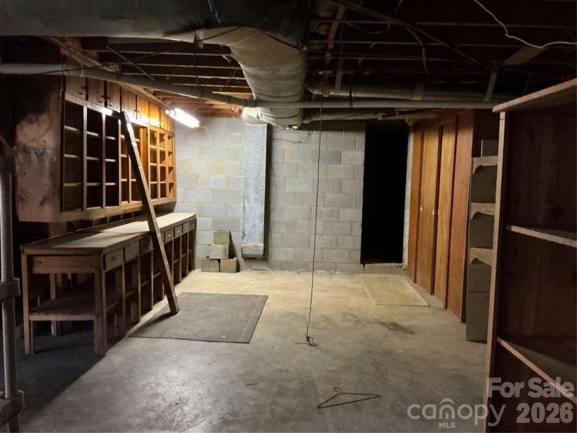 219 Central Avenue, Locust, NC 28097.  MLS# CAR4368249, YatesRealty ID 10940. Basement garage