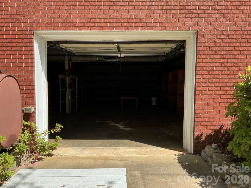 219 Central Avenue, Locust, NC 28097.  MLS# CAR4368249, YatesRealty ID 10940. Basement garage