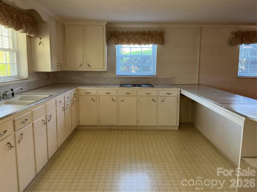 219 Central Avenue, Locust, NC 28097.  MLS# CAR4368249, YatesRealty ID 10940. Basement kitchen
