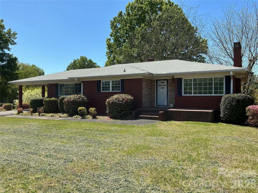 219 Central Avenue, Locust, NC 28097.  MLS# CAR4368249, YatesRealty ID 10940. Beautiful home with lovely yard