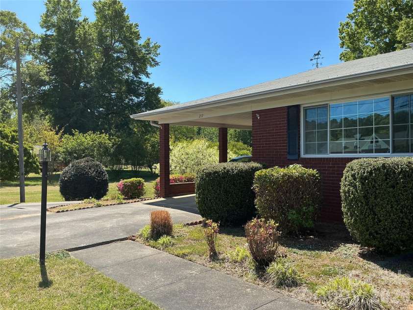 219 Central Avenue, Locust, NC 28097.  MLS# CAR4368249, YatesRealty ID 10940. Carport