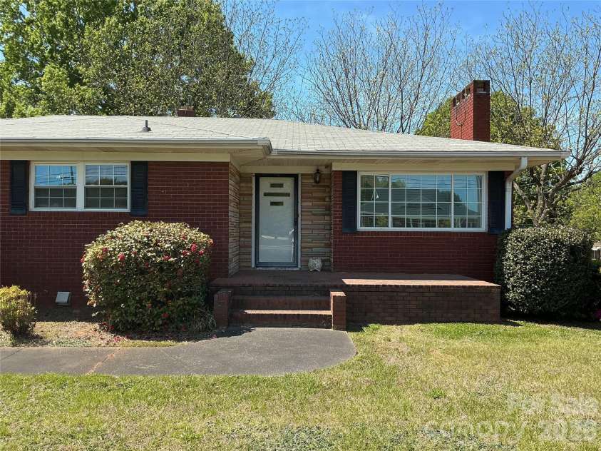 219 Central Avenue, Locust, NC 28097.  MLS# CAR4368249, YatesRealty ID 10940. Front of home