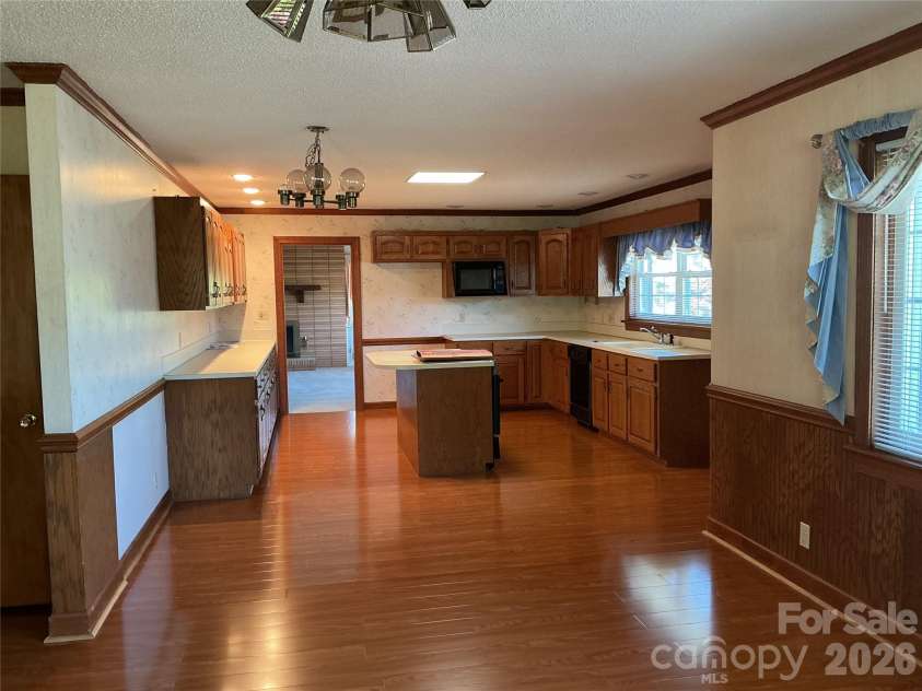 219 Central Avenue, Locust, NC 28097.  MLS# CAR4368249, YatesRealty ID 10940. Open living room with kitchen