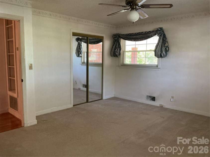 219 Central Avenue, Locust, NC 28097.  MLS# CAR4368249, YatesRealty ID 10940. Primary bedroom