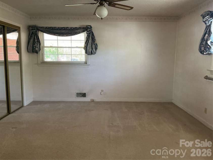 219 Central Avenue, Locust, NC 28097.  MLS# CAR4368249, YatesRealty ID 10940. Primary bedroom