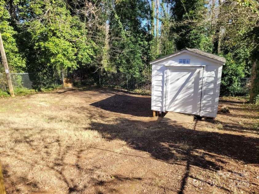 1116 East Drive, Gastonia, NC 28052.  MLS# CAR4211550, YatesRealty ID 10947. Storage Building and Backyard