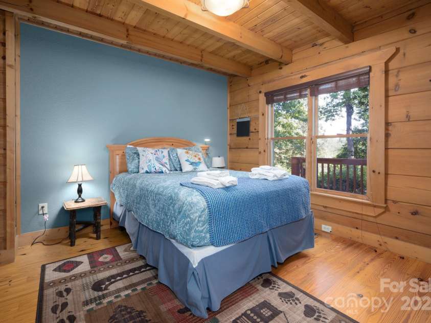 117 Laurel Lakes Parkway, Lake Lure, NC 28746.  MLS# CAR4182403, YatesRealty ID 10954. Main floor bedroom