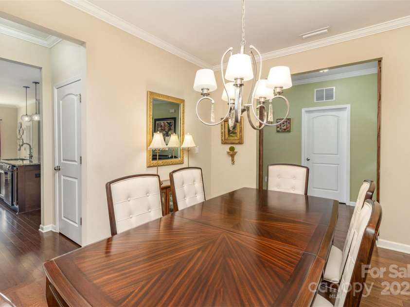 116 Water Ski Drive, Statesville, NC 28677.  MLS# CAR4239972, YatesRealty ID 10957. Dining room features a direct pass through to the kitchen.  There is a butler's pantry area and large pantry.  From the entry hall, this room has sliding doors to close off the space if desired.