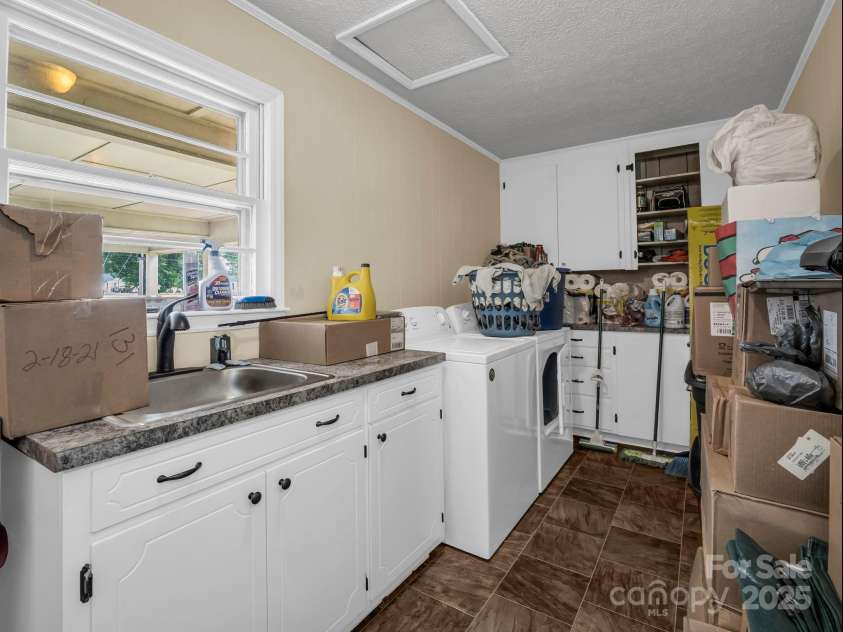 501 Weaver Street, Cherryville, NC 28021.  MLS# CAR4287583, YatesRealty ID 1096. Laundry room with plenty of storage