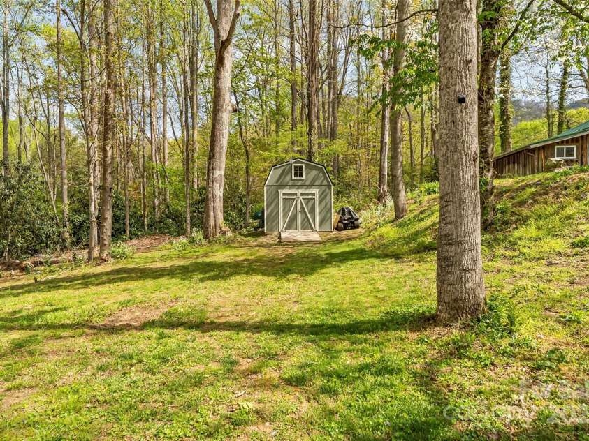 11 Hunting Lodge Drive, Black Mountain, NC 28711.  MLS# CAR4244815, YatesRealty ID 10963. Large shed that blends in w/ beautiful setting