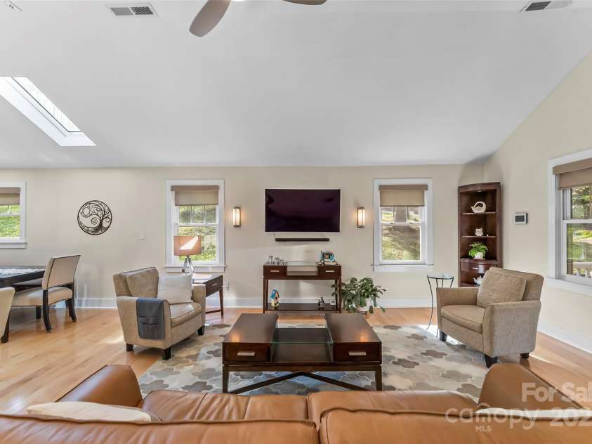 11 Hunting Lodge Drive, Black Mountain, NC 28711.  MLS# CAR4244815, YatesRealty ID 10963. Living area with calming sconces