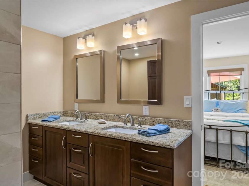 11 Hunting Lodge Drive, Black Mountain, NC 28711.  MLS# CAR4244815, YatesRealty ID 10963. Primary bathroom w/ dual vanities