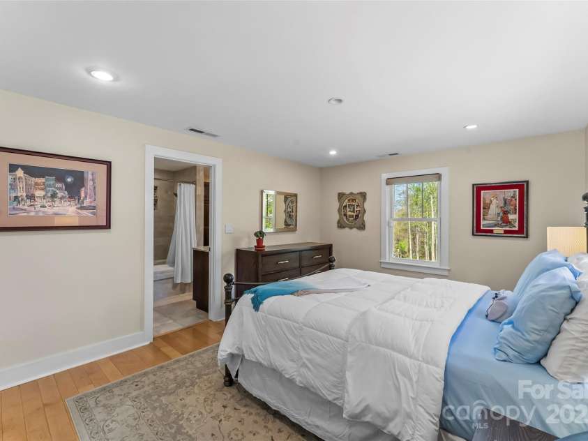 11 Hunting Lodge Drive, Black Mountain, NC 28711.  MLS# CAR4244815, YatesRealty ID 10963. Primary bedroom into updated full bath