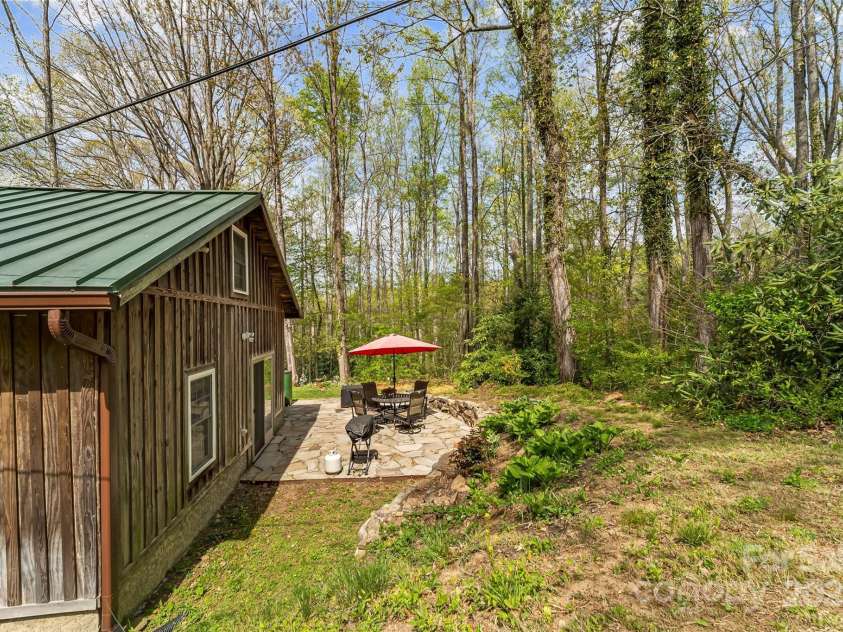 11 Hunting Lodge Drive, Black Mountain, NC 28711.  MLS# CAR4244815, YatesRealty ID 10963. Serene back patio of guest house