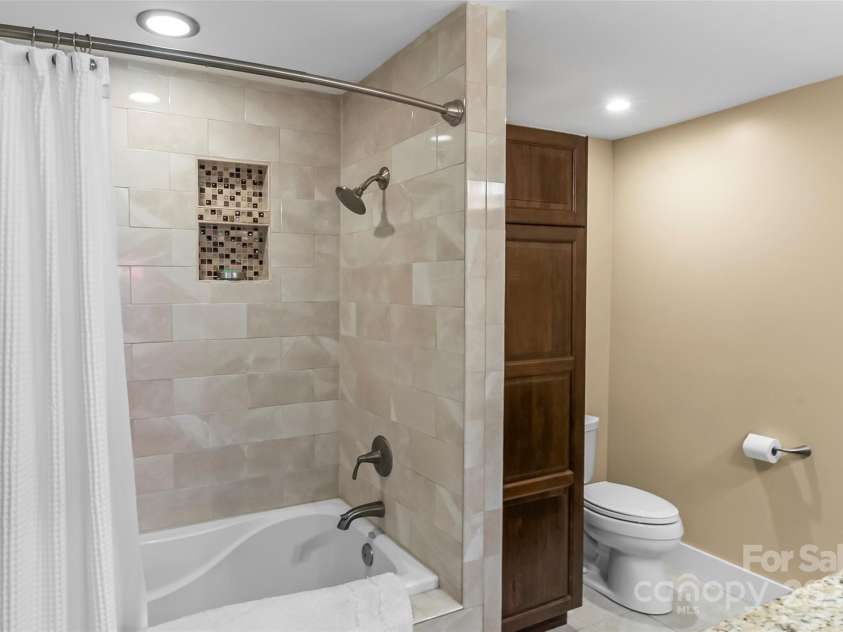 11 Hunting Lodge Drive, Black Mountain, NC 28711.  MLS# CAR4244815, YatesRealty ID 10963. Spectacular updates in the primary bathroom