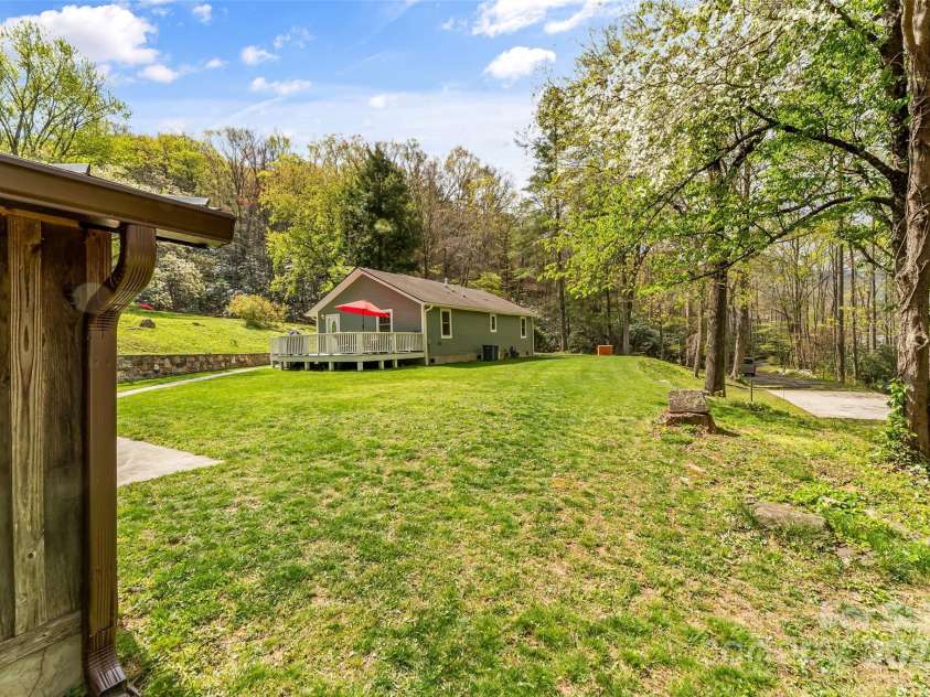 11 Hunting Lodge Drive, Black Mountain, NC 28711.  MLS# CAR4244815, YatesRealty ID 10963. Terrific yard space allows privacy between home and guest house.