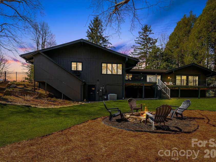 254 Orchard Circle, Laurel Park, NC 28739.  MLS# CAR4363320, YatesRealty ID 10980. Back yard is great for entertaining - virtual twilight