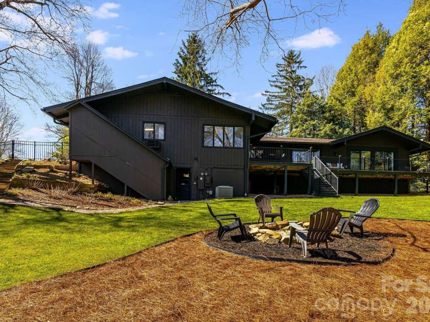 254 Orchard Circle, Laurel Park, NC 28739.  MLS# CAR4363320, YatesRealty ID 10980. Fully fenced backyard with fire pit
