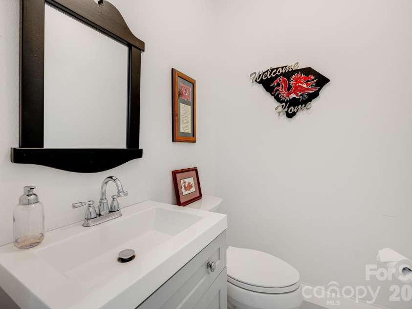 254 Orchard Circle, Laurel Park, NC 28739.  MLS# CAR4363320, YatesRealty ID 10980. Half bath connected to garage