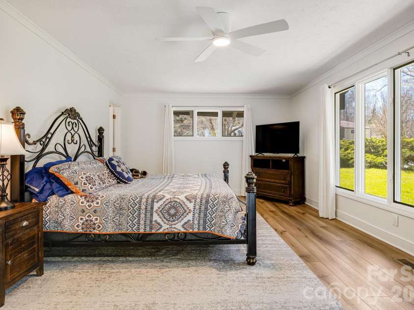254 Orchard Circle, Laurel Park, NC 28739.  MLS# CAR4363320, YatesRealty ID 10980. Primary bedroom with attached bathroom