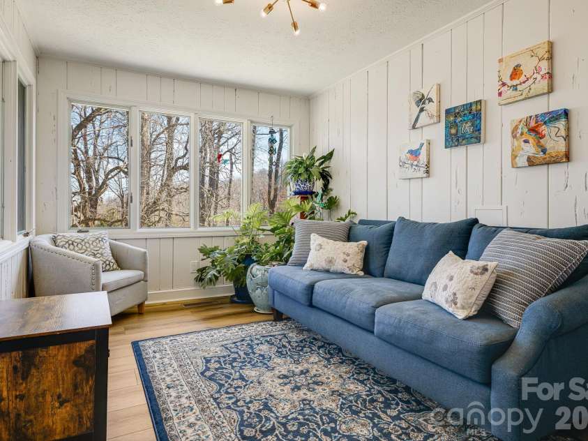 254 Orchard Circle, Laurel Park, NC 28739.  MLS# CAR4363320, YatesRealty ID 10980. Sunroom off the kitchen