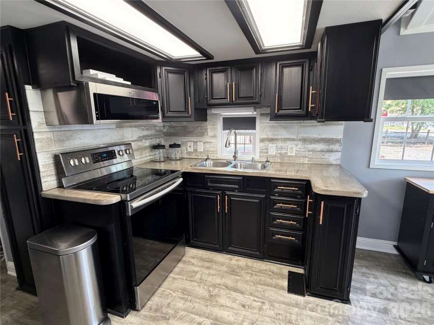 156 Marina Drive, New London, NC 28127.  MLS# CAR4365180, YatesRealty ID 10981. 