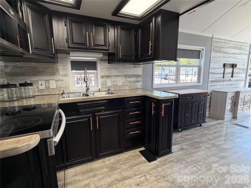 156 Marina Drive, New London, NC 28127.  MLS# CAR4365180, YatesRealty ID 10981. 