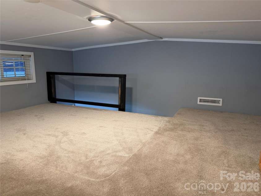 156 Marina Drive, New London, NC 28127.  MLS# CAR4365180, YatesRealty ID 10981. Sleeping loft