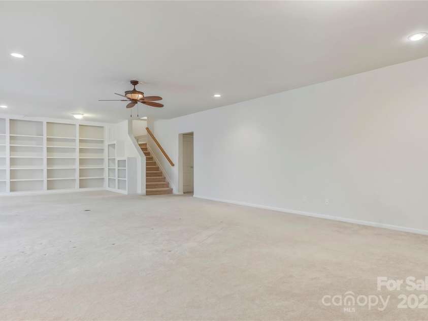 3015 Duclair Lane, Fort Mill, SC 29707.  MLS# CAR4237048, YatesRealty ID 10985. Electric stair chair virtually removed to show what it would look like.