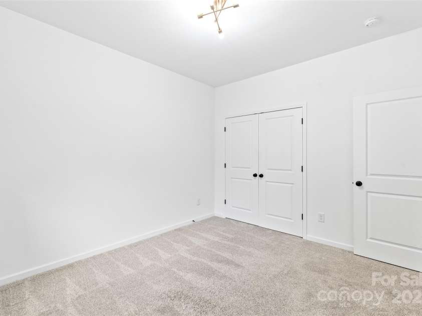 1212 Mason Way, Mount Holly, NC 28120.  MLS# CAR4281263, YatesRealty ID 10986. Double-doored closet in the guest room