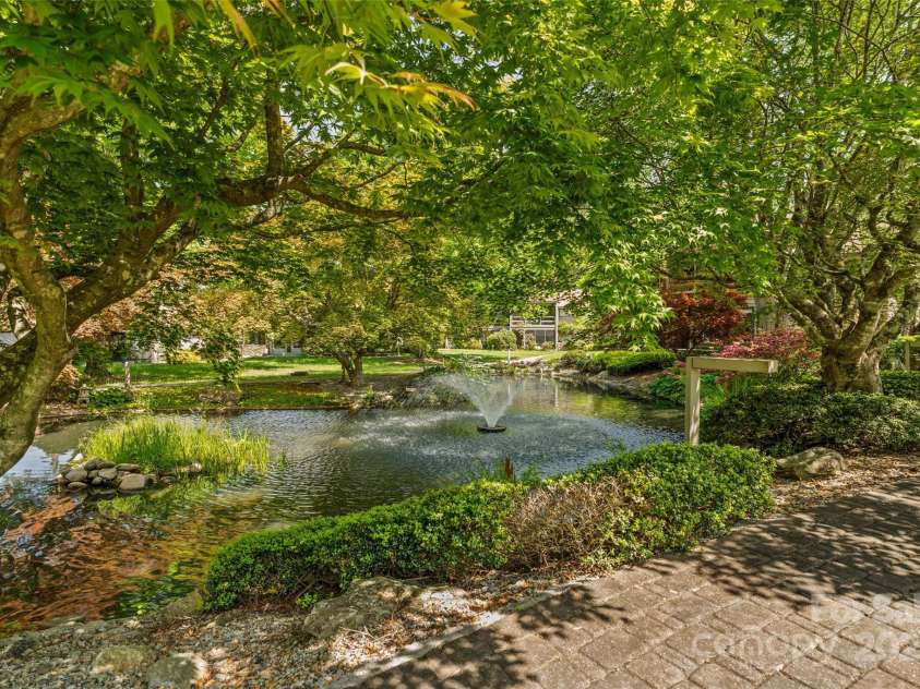 5 Lakemoor Lane, Hendersonville, NC 28739.  MLS# CAR4253352, YatesRealty ID 10990. Private Pond