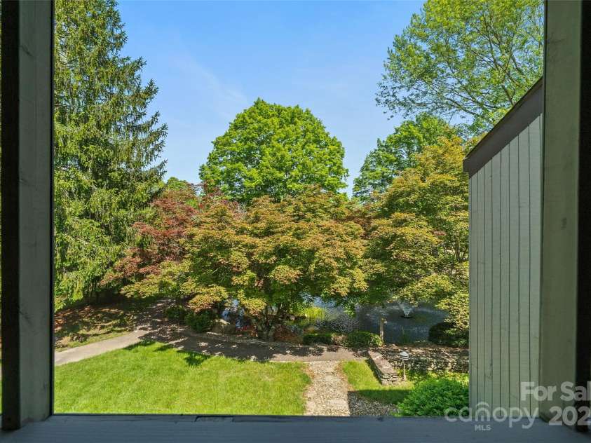 5 Lakemoor Lane, Hendersonville, NC 28739.  MLS# CAR4253352, YatesRealty ID 10990. Screened Porch view