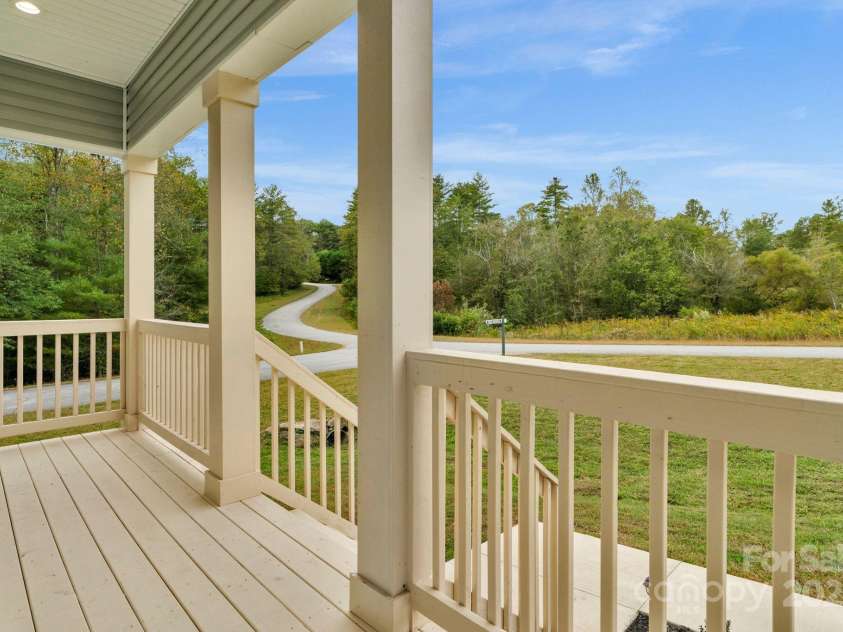 142 Crystal Heights Drive, Hendersonville, NC 28739.  MLS# CAR4310051, YatesRealty ID 110. Covered back porch