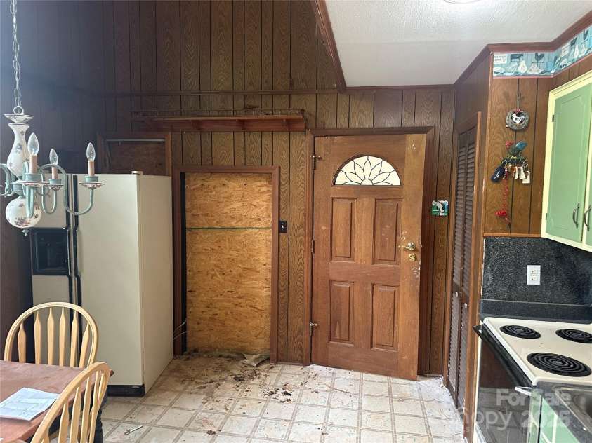 177 Mountain View Lane, Troy, NC 27371.  MLS# CAR4269979, YatesRealty ID 110. Kitchen side of the wall that was built to be removed and open it up.