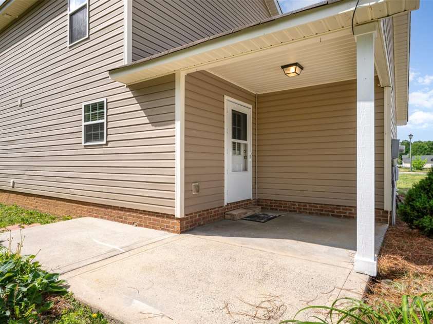 8309 Knapp Court, Locust, NC 28097.  MLS# CAR4222217, YatesRealty ID 11010. Back door and patio