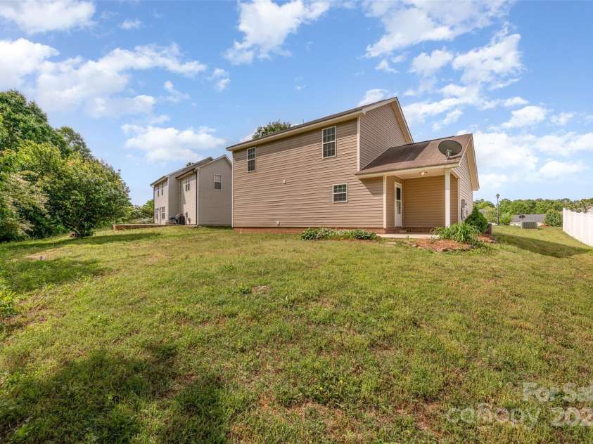8309 Knapp Court, Locust, NC 28097.  MLS# CAR4222217, YatesRealty ID 11010. Backyard of home