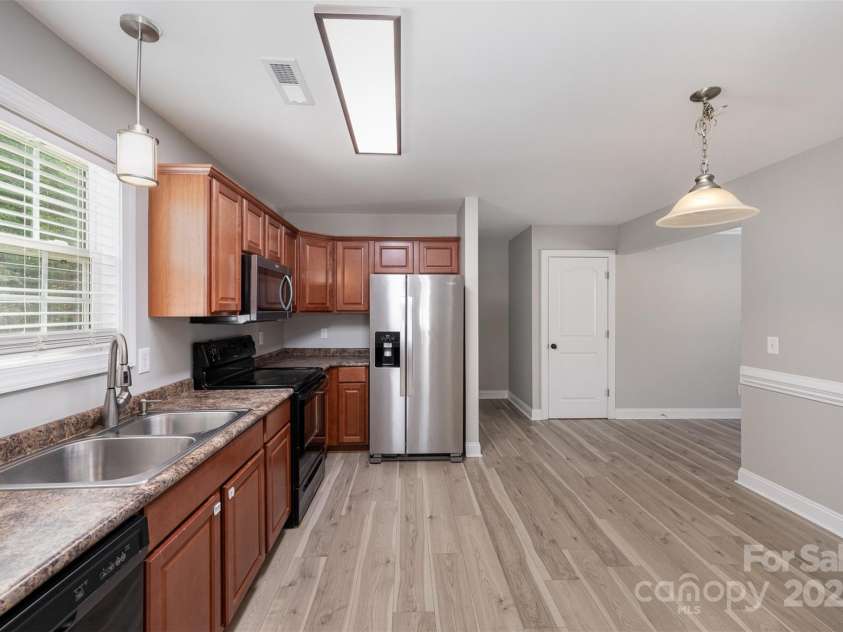 8309 Knapp Court, Locust, NC 28097.  MLS# CAR4222217, YatesRealty ID 11010. Side View of Kitchen from back door