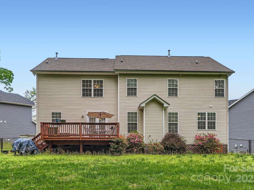 10836 Maryanna Court, Charlotte, NC 28213.  MLS# CAR4248594, YatesRealty ID 11011. Back view of the house, patio/deck, & fenced yard