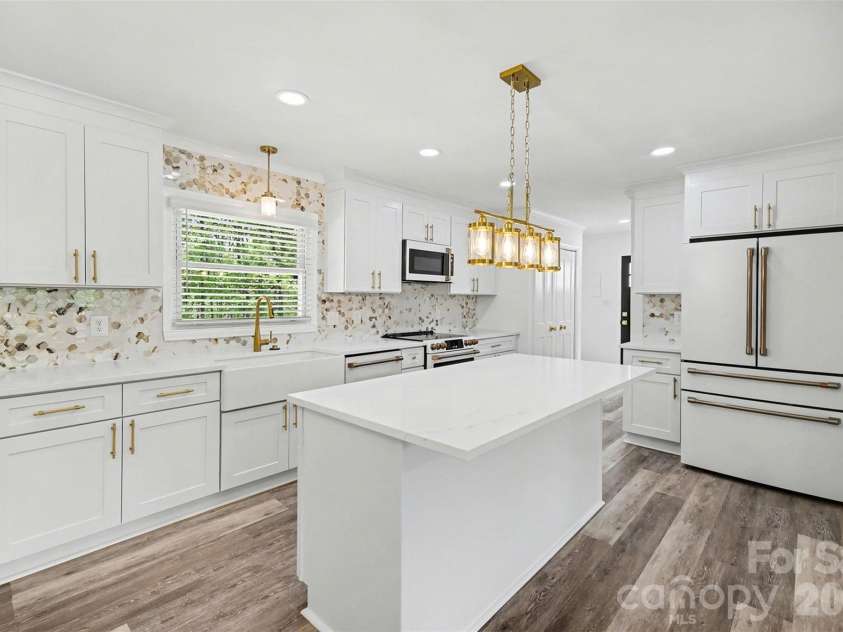 11630 Trails End Lane, Huntersville, NC 28078.  MLS# CAR4342080, YatesRealty ID 11011. New designer cabinets, modern lighting fixtures and plumbing fixtures 