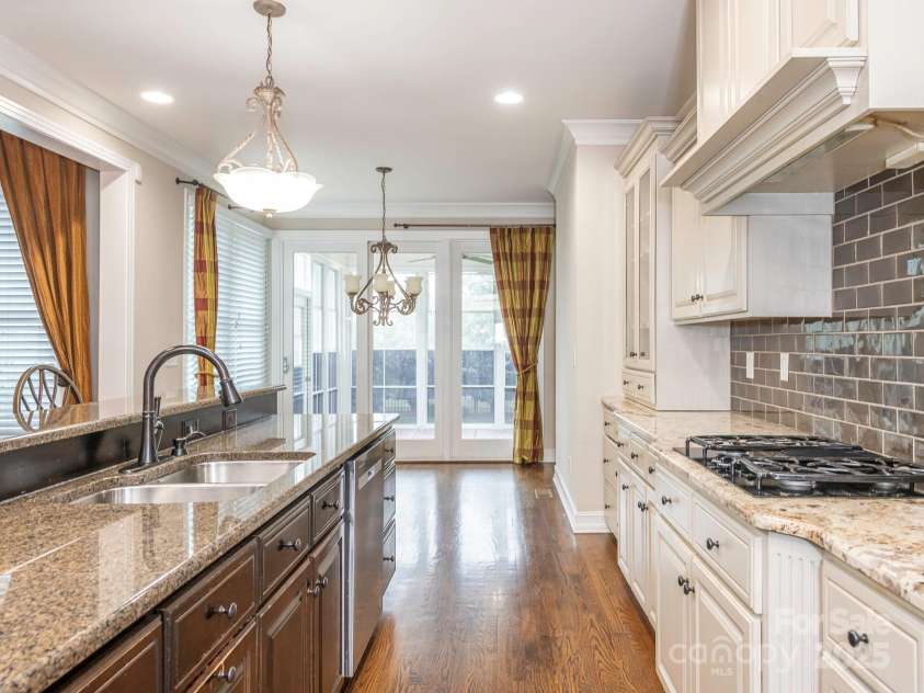 3850 Hounslow Lane, Harrisburg, NC 28075.  MLS# CAR4216435, YatesRealty ID 11023. Abundant custom cabinetry