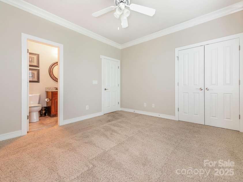 3850 Hounslow Lane, Harrisburg, NC 28075.  MLS# CAR4216435, YatesRealty ID 11023. Additional main-level bedroom with direct access to full bath