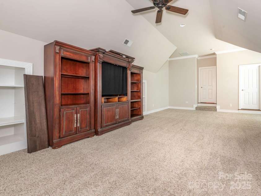 3850 Hounslow Lane, Harrisburg, NC 28075.  MLS# CAR4216435, YatesRealty ID 11023. Furniture piece in the bonus room conveys with the property