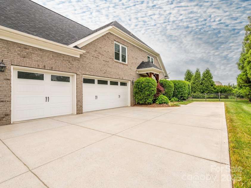 3850 Hounslow Lane, Harrisburg, NC 28075.  MLS# CAR4216435, YatesRealty ID 11023. Large, side load, 3-car garage