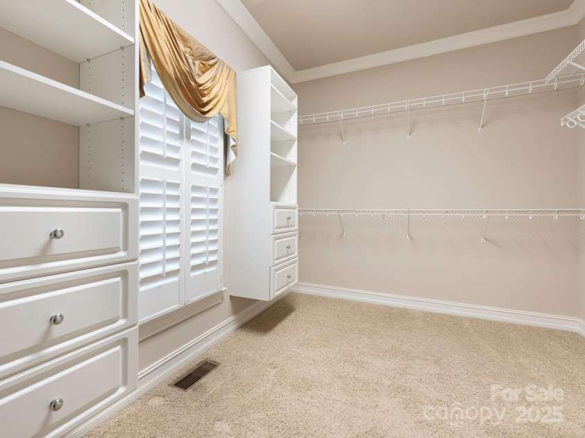 3850 Hounslow Lane, Harrisburg, NC 28075.  MLS# CAR4216435, YatesRealty ID 11023. Large walk-in closet includes a linen closet