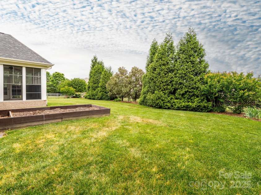 3850 Hounslow Lane, Harrisburg, NC 28075.  MLS# CAR4216435, YatesRealty ID 11023. Mature landscaping, irrigation system, raised garden beds