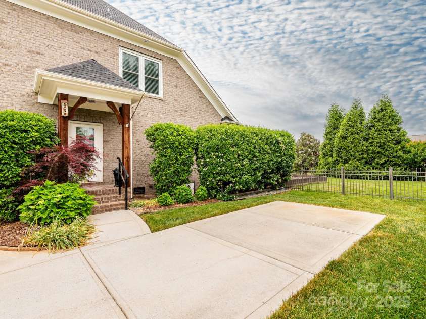 3850 Hounslow Lane, Harrisburg, NC 28075.  MLS# CAR4216435, YatesRealty ID 11023. Outside entrance into the laundry and drop zone area