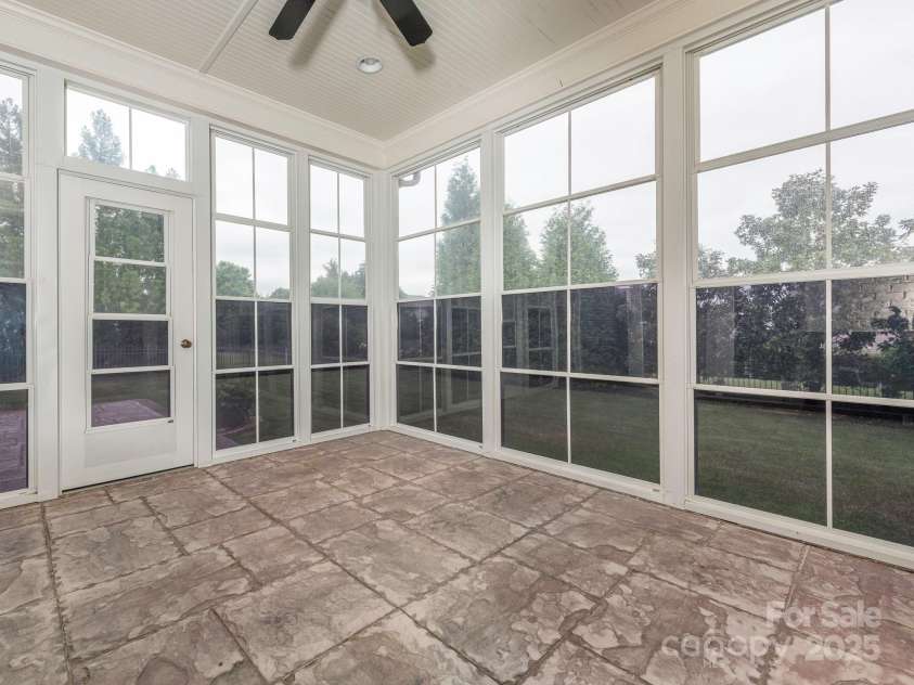 3850 Hounslow Lane, Harrisburg, NC 28075.  MLS# CAR4216435, YatesRealty ID 11023. Welcoming sun porch with windows